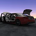 Red Sedan Car With Open Hood And Doors Against Sunset Sky On Gray Pavement