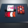 Assorted Colorful Chocolates With Heart And Square Shapes On Black Display Tray