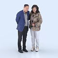 Two Middle Aged People Standing Together In Casual Coats Against Light Background