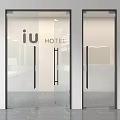 Modern Glass Swing Doors for Hotel Entrance Featuring Black Frames and Handles