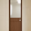 Brown Wooden Door with White Grid Glass Panel and Round Handles in Tile Wall Interior