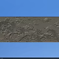 Traditional Style Relief Carving with Birds Trees Sun and Blue Background