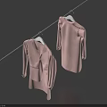 Two Pink Clothes Hanging on a Clothesline with White Hangers and Dark Blue Backdrop