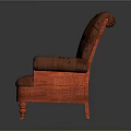 Red Upholstered Armchair With Patterned Fabric And Carved Wooden Legs