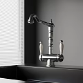 Classic Chrome Kitchen Faucet With White Handles On Black Countertop Near Window Blinds