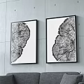 Interior Scene With Black Leather Chair Light Wood Chair Tree Ring Artworks And Green Plant