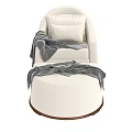 Cozy White Upholstered Lounge Chair and Ottoman With Gray Throw and Pillows