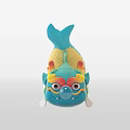 Blue Fish Shaped Doll With Lion Like Face Yellow Accents And Blowing Bubble