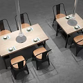 Wooden Dining Table And Chair Combination With Black Frames Brown Seats And Round Metal Plates