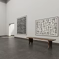 Spacious White Gallery Interior Featuring Large Black White Abstract Paintings Wooden Benches Dark Stone Floor