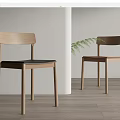 Simple Design Wooden Dining Chairs With Black Brown Seats And Green Plant In Light Space