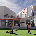 Modern Container Building With Large Glass Windows Balcony And Outdoor Gathering Space