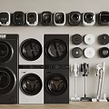 Multiple Front Loading Washing Machines in Black and White with Home Appliances