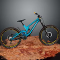 Blue Mountain Bike Showcased on Red Rocky Surface with Sturdy Frame Design