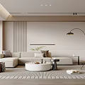 Modern Minimalist Living Room With Beige Sofa Round Coffee Table And Floor Lamp