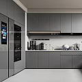 Modern Kitchen With Grey Cabinets Black Appliances Wine Glasses Utensils Fruits Cutting Board And Plant