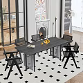 Modern Restaurant Interior With Black Dining Table Chairs Fireplace Artwork Checkerboard Rug And Oranges