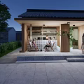 Traditional Style Commercial Street With Wooden Structure Outdoor Seating Greenery And People Relaxing