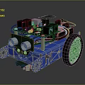 Small Robot With Blue Frame Green Circuit Board Black Motors And White Wheels