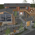 Rustic Wooden Building with Outdoor Terrace Stone Ground and Tables Chairs Surrounded by Trees