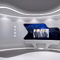 Modern Exhibition Hall With Large Blue Screen Diagrams Tall Column Display And White Cabinets