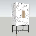 Elegant White Decorative Cabinet With Black Branch Patterns Gold Panel And Black Slender Legs