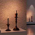 Decorative Ornament Set With Lit Candles On Wooden Candlesticks Of Different Heights And Textured Wall
