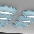 Light Blue Oval Lighting Fixtures With White Light Sources Arranged Neatly Against Gray Background