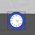 Minimalist Round Blue Frame Table Clock With White Dial And Black Numbers