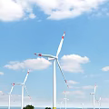 Multiple White Wind Turbine Blades With Red Markings Under Blue Sky And Clouds