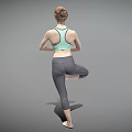 Woman Practicing Yoga Tree Pose Standing On One Leg With Hands In Prayer
