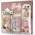 Baby Clothing Display Shelves With Hanging Outfits Plush Toys And Decorative Plants