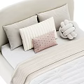 Cozy Kids Bed With Beige Curved Headboard White Quilt And Knotted Pillow