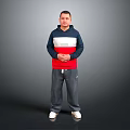 Man Standing in Navy Blue White and Red Hoodie With Gray Pants and White Shoes