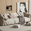 Beige Large Sectional Sofa with Throw Pillows Gray Blanket Books on Rug and Wooden Cabinets