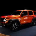 Orange SUV with Black Rims and Roof Rack on Display Stand Against Black Background
