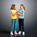 Two Happy Girls Talking And Interacting In Colorful Shirts And Pants On Gray Background