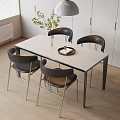 Modern Dining Table Set with White Tabletop Black Chairs and Green Plant in Modern Kitchen