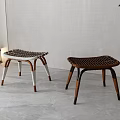Woven Seat Wooden Stools With Light And Dark Colored Legs In Modern Indoor Space