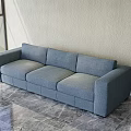 Modern Gray Fabric Multi Seater Sofa Against Light Colored Wall With Marble Floor 3d model
