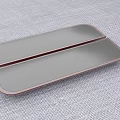 Golden Metal Cabinet Handle Design On Black Panel With Gray Fabric Surface