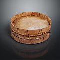 Traditional Wooden Round Musical Drum With Rope Bindings On Dark Reflective Surface