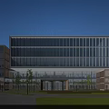 Modern Office Building With Glass Curtain Wall Adjacent Structure Front Lawn And Pathway