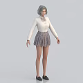 Woman with gray hair wearing white shirt with bow plaid skirt and black shoes