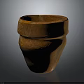 Terracotta Clay Pot With Cracked Surface And Intricate Carved Patterns