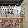 Modern Boutique Store Interior Featuring Shelves With Products White Counter And Wooden Chairs