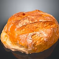 Freshly Baked Round Bread With Golden Crusty Surface And Flour Dusting