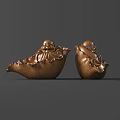 Two Golden Buddha Sculptures With Smiling Expressions And Lotus Leaf Bases
