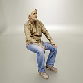 White haired Elderly Man Sitting in Gray Background Wearing Brown Shirt and Blue Jeans Smiling