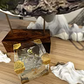 Transparent Glass Cube Decorative Ornament Set With Golden Corner Accents On Wooden Tabletop